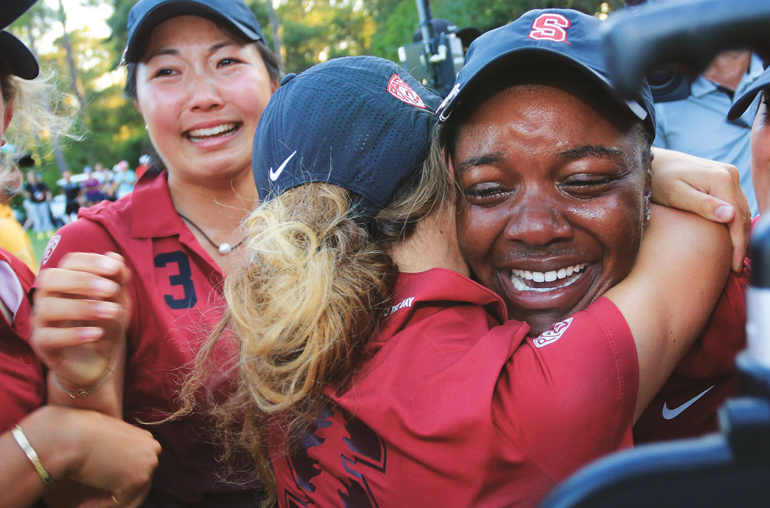 Stackhouse being hugged by teammates