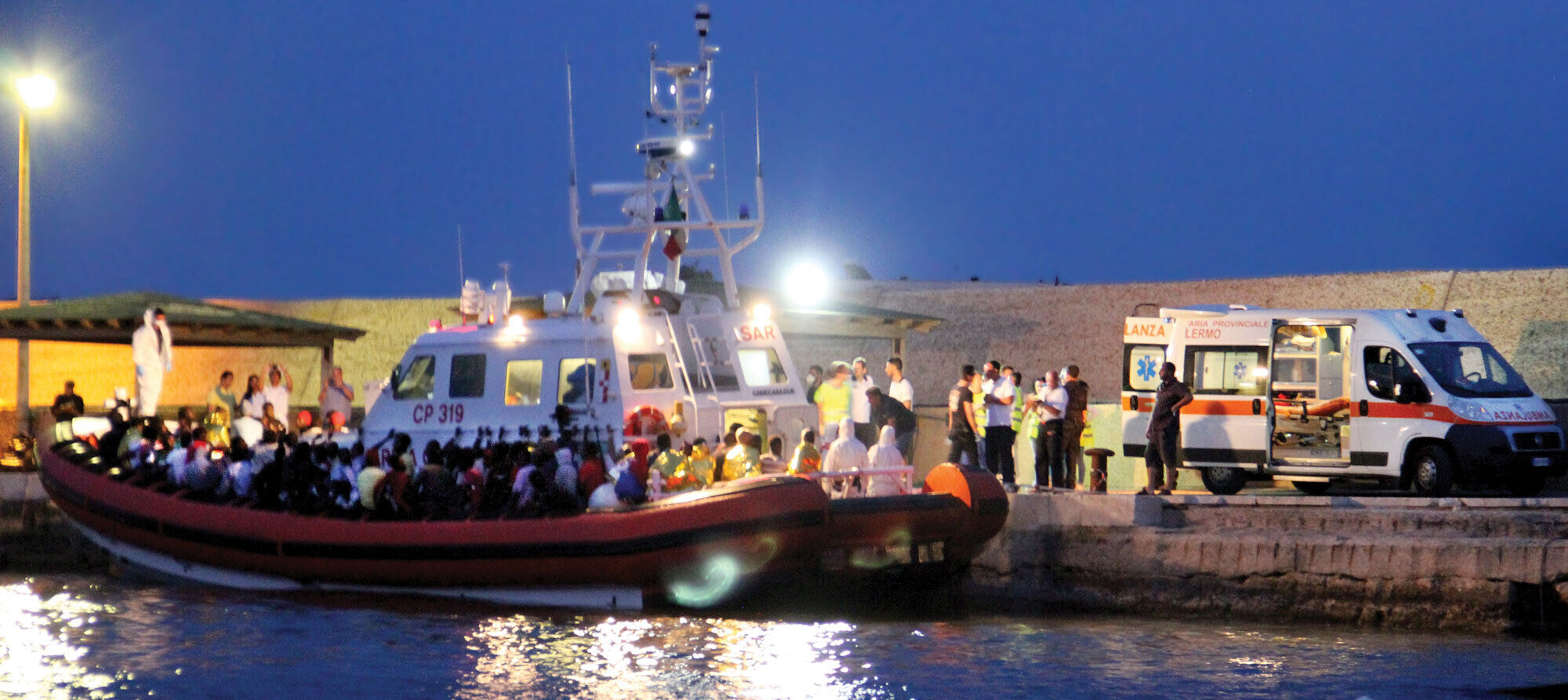 A migrant ship in port