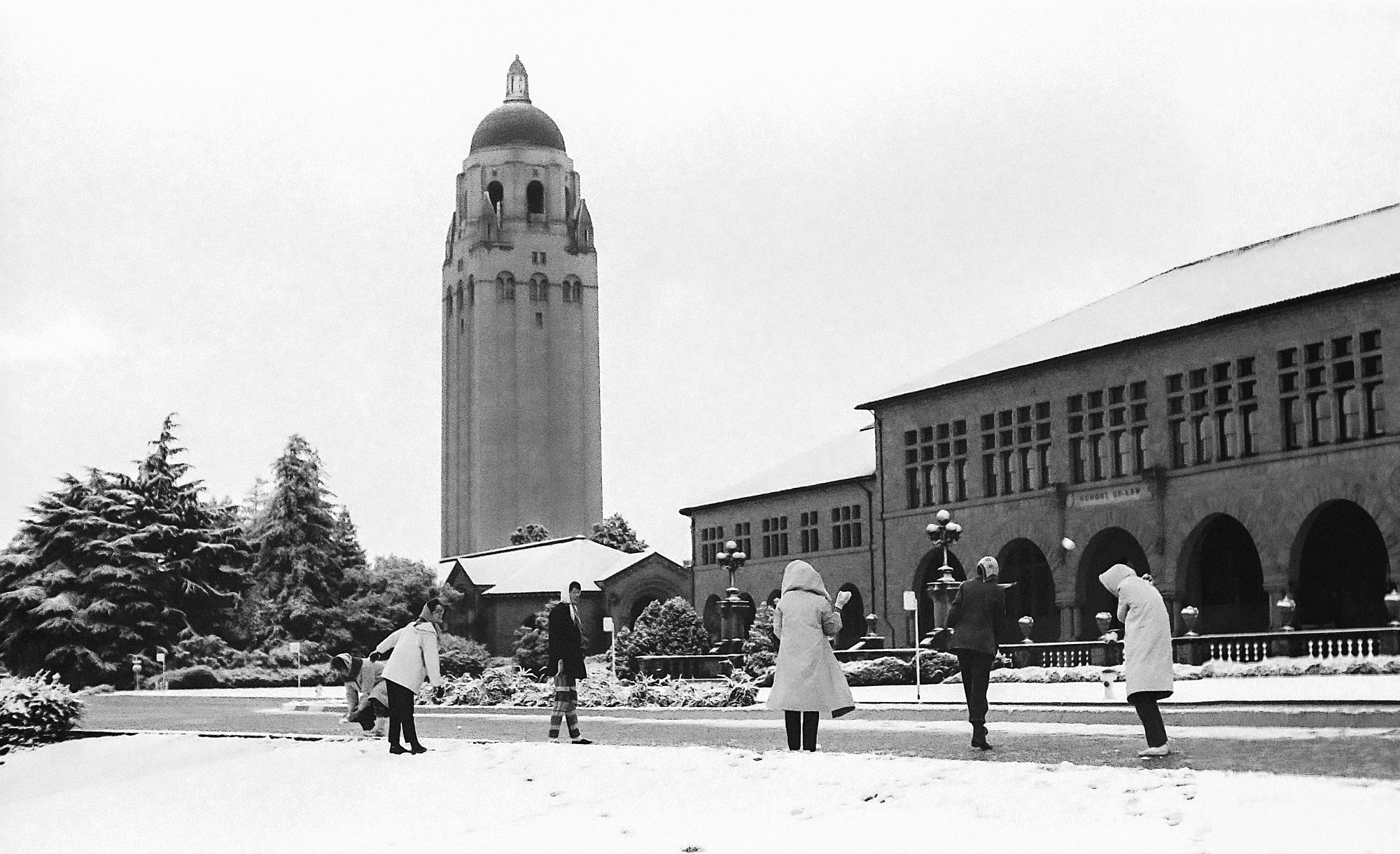Students throwing snowballs on the Oval