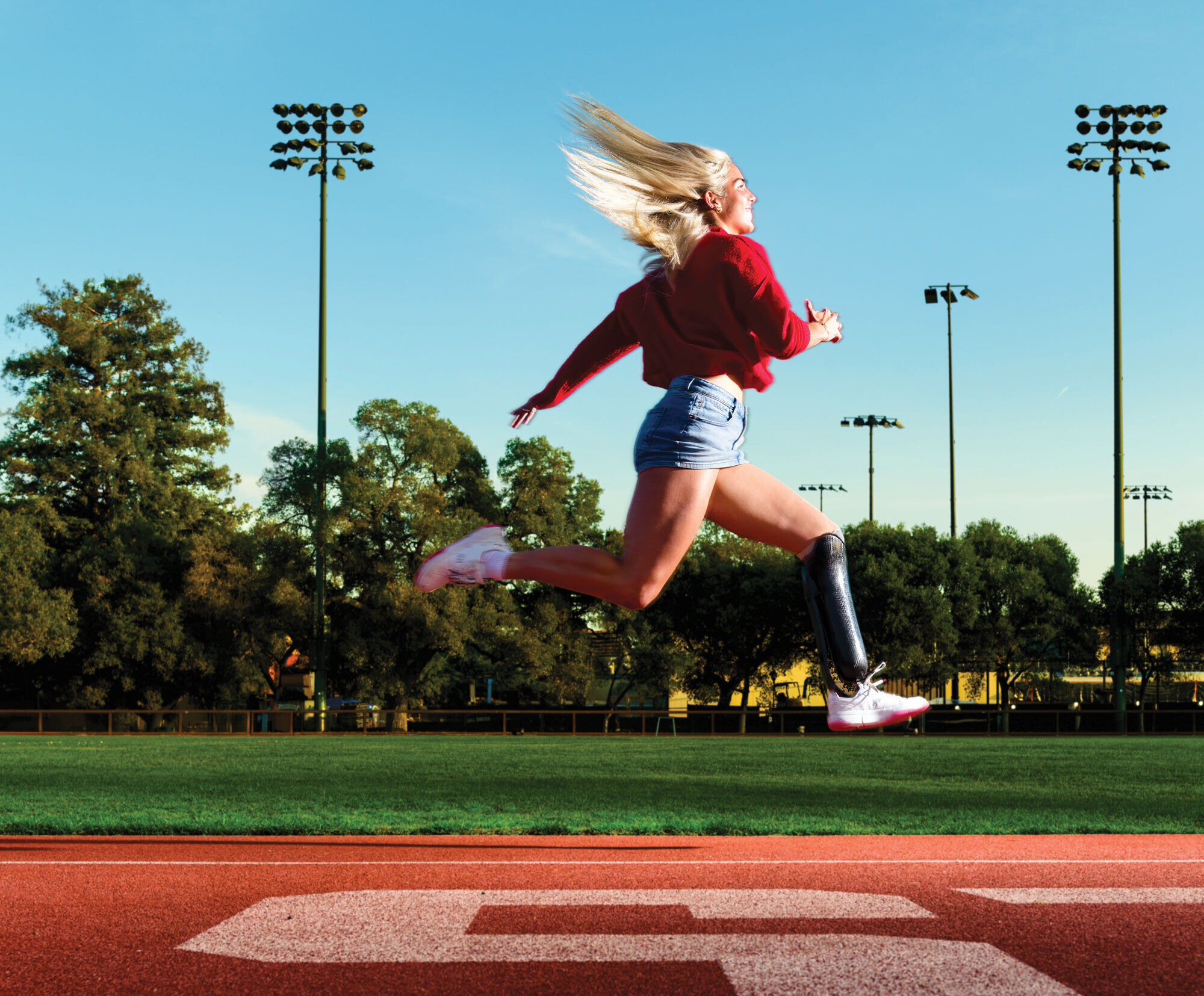 Barta running and leaping on the Stanford track.