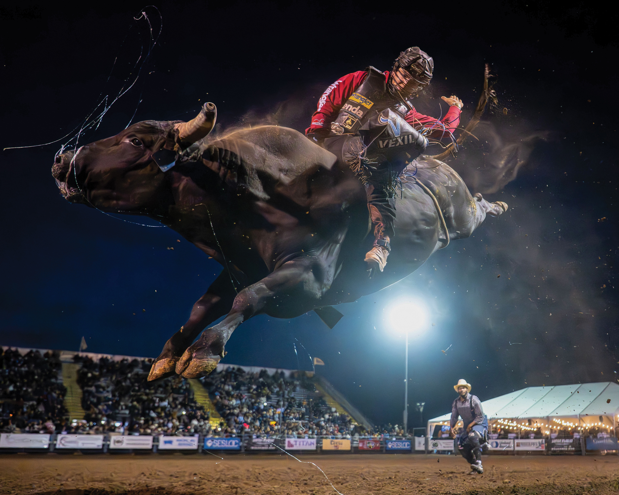 A person riding a bull