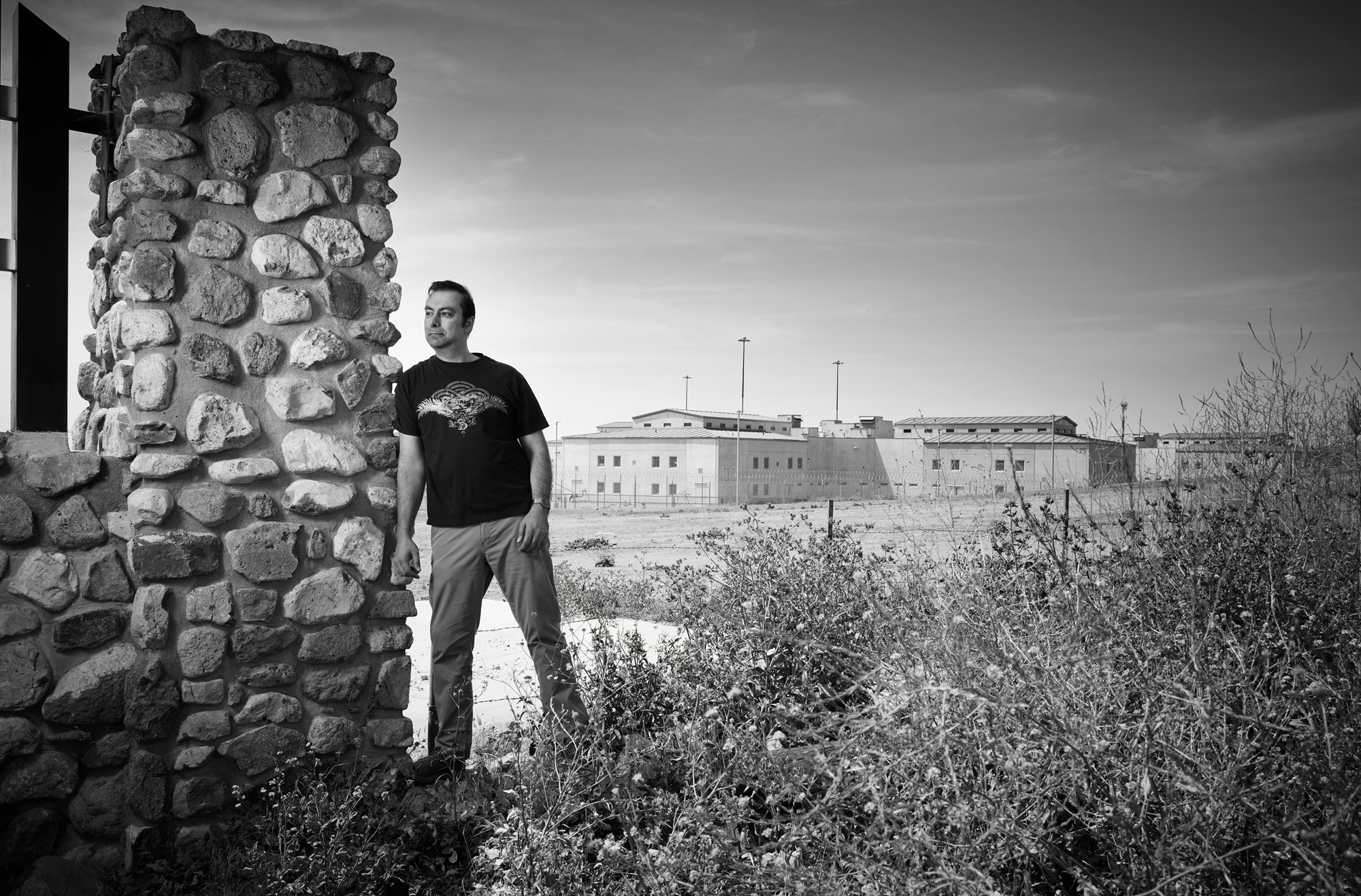 Zaid Rafin standing in front of a prison complex.