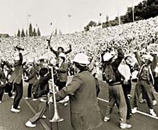 The Stanford Band plays close to the crowd, gathered without any clear organization, playing wildly.