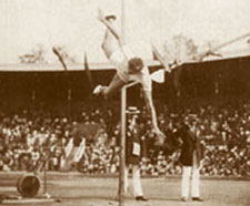 George Horine attempts the high-jump in front of a crowd.