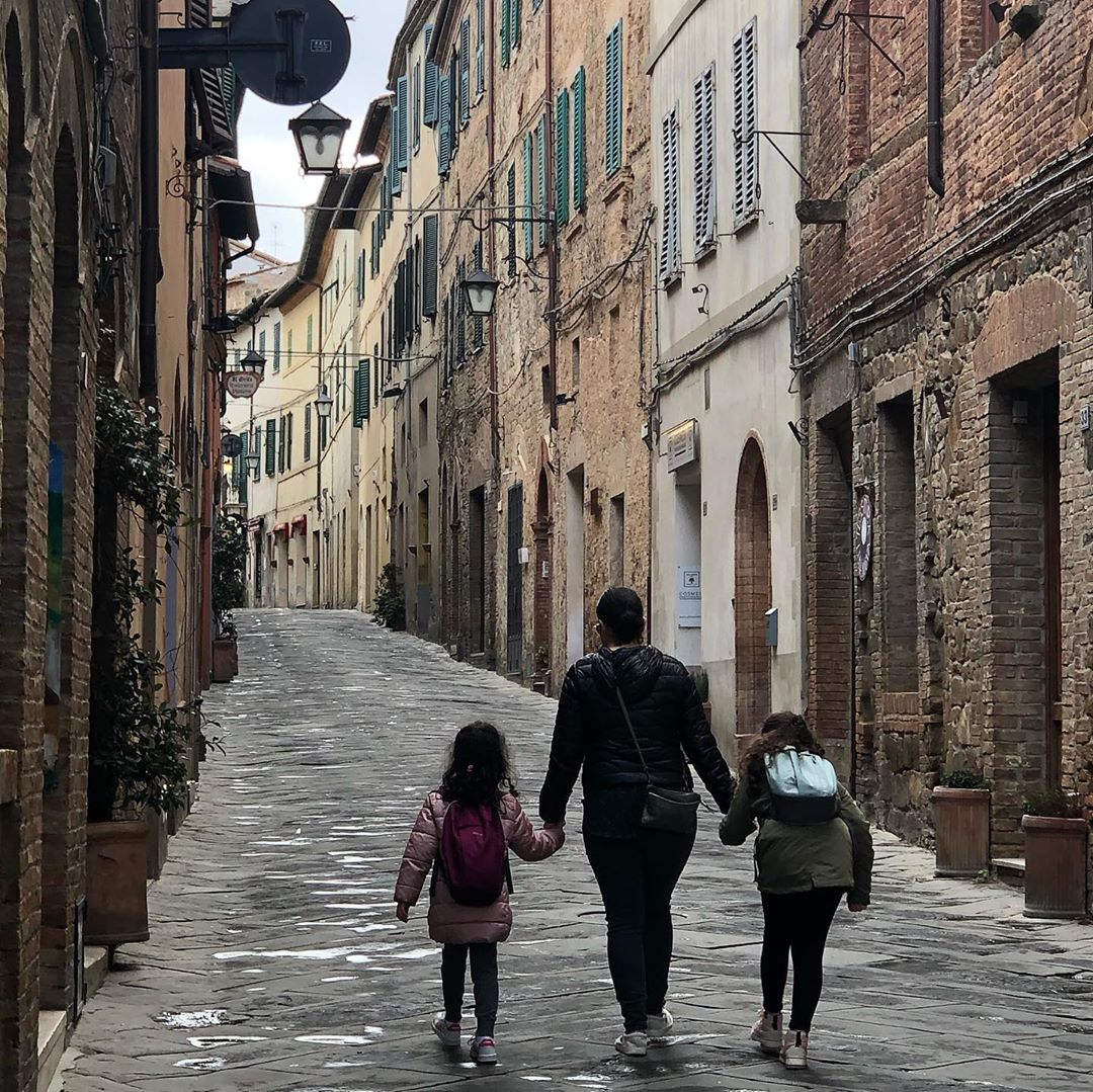 Family walking down streets of Milan