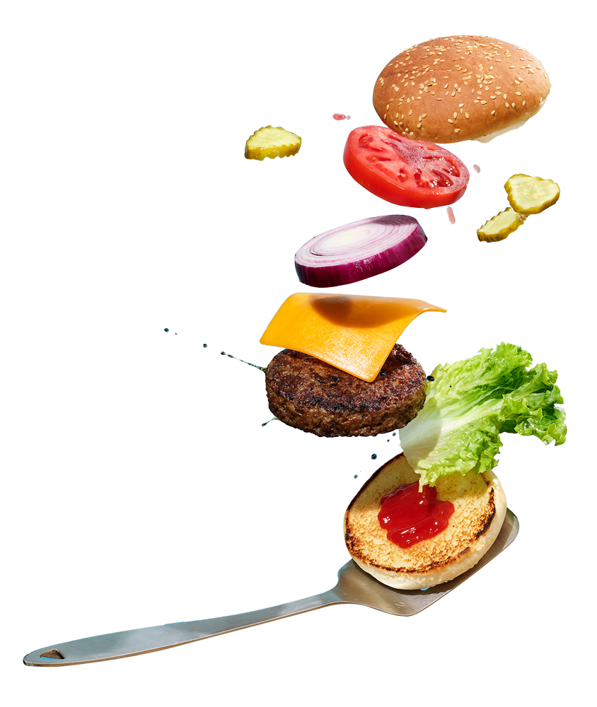 A deconstructed photograph of a hamburger being flipped by a spatula.