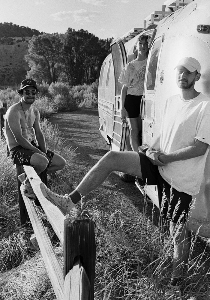 Hamamoto, Doyle and Tripp standing in front of the Airstream.