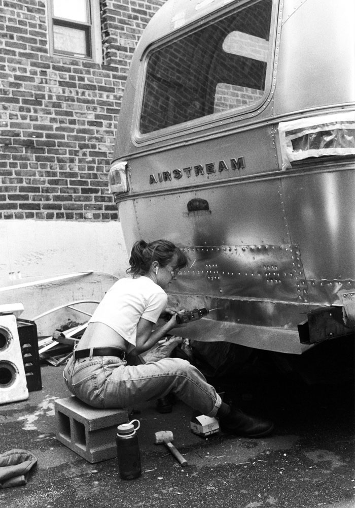 Doyle adds a storage compartment to the Free Film: USA Airstream trailer outside Worthless Studios in Manhattan.