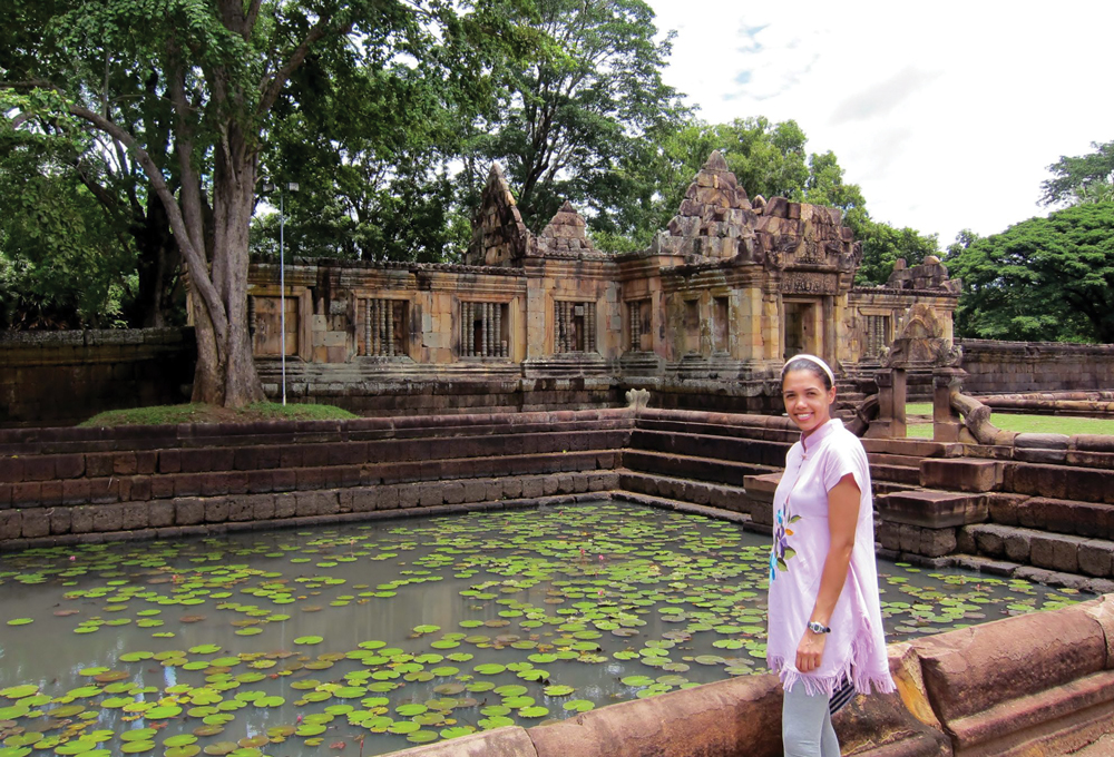 Amber Moore in front of a pond in Thailand