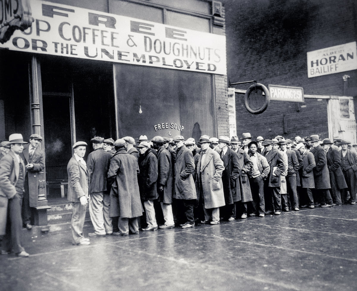 Unemployed men queued outside a depression-era soup kitchen opened in Chicago by Al Capone. Photo taken February 1931.