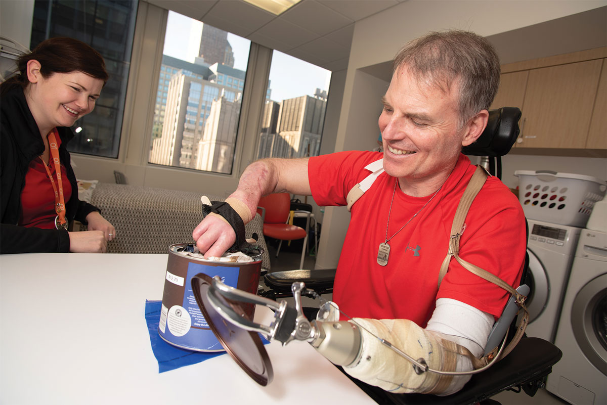 Marty Hartigan practicing opening a coffee can