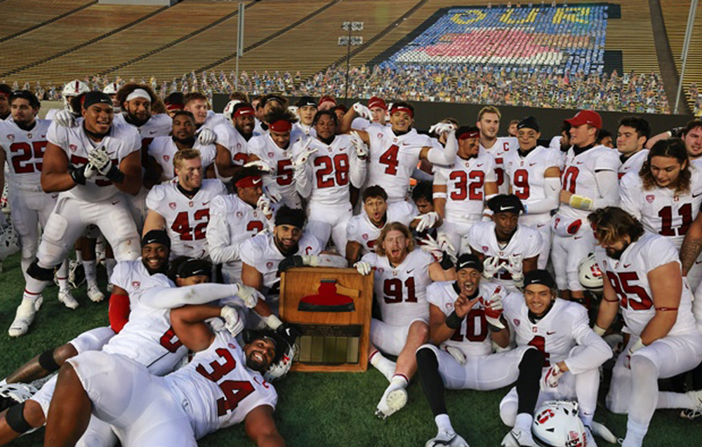 Stanford football team surrounding the Axe