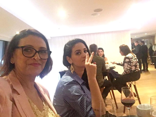 Photo of Luciana Frazao and her mother at an event.