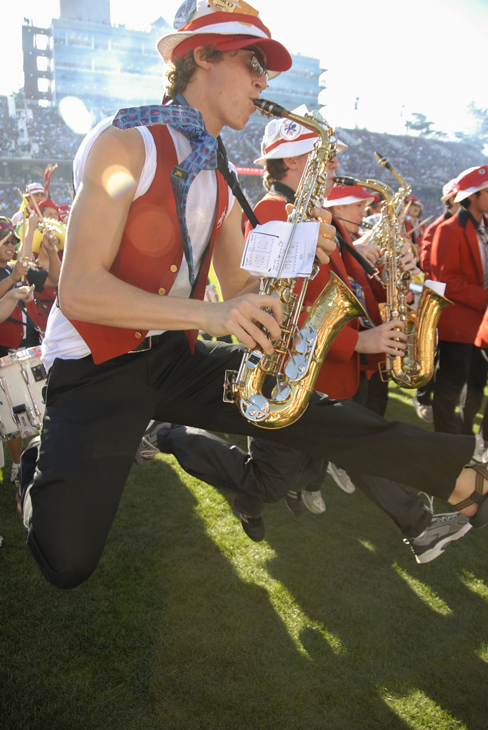Sax players jumping with their horns