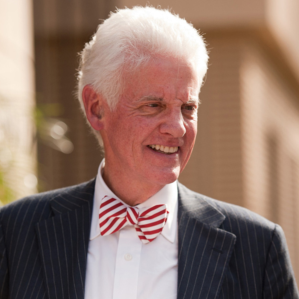 William Neukom in a suit and red-striped bowtie.