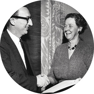 Ricker shaking hands with an administrator.