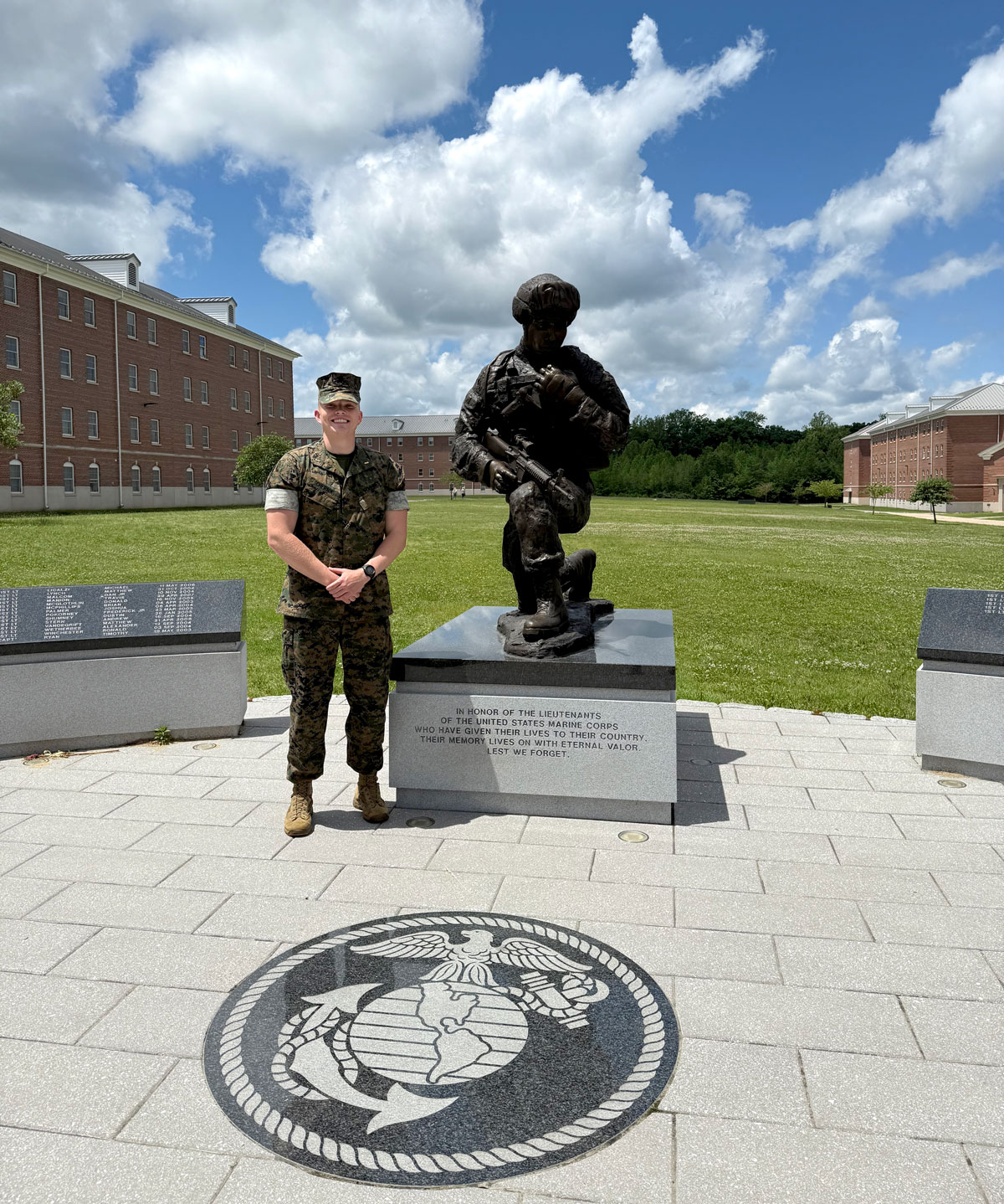 Chernik, in fatigues, at a Marine memorial site.