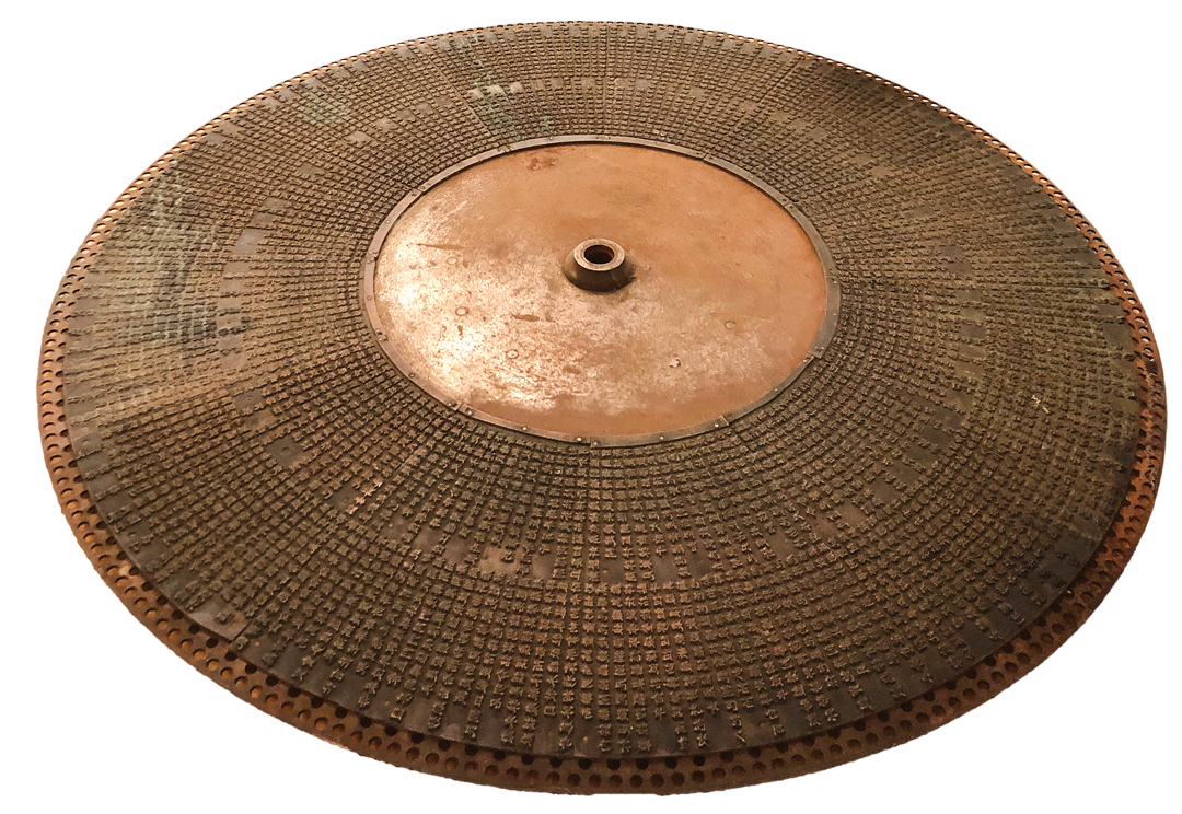 large metal disc covered in thousands of precisely rendered Chinese characters