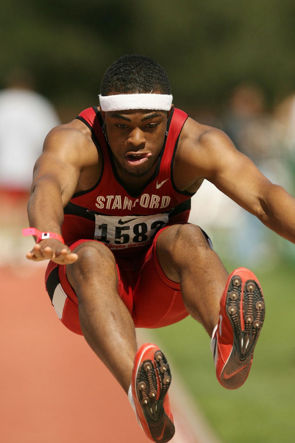 Dr. O doing the long jump in Stanford track gear.
