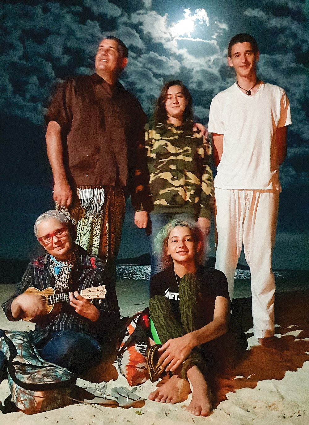 Photo of Johnson and his family on the beach.