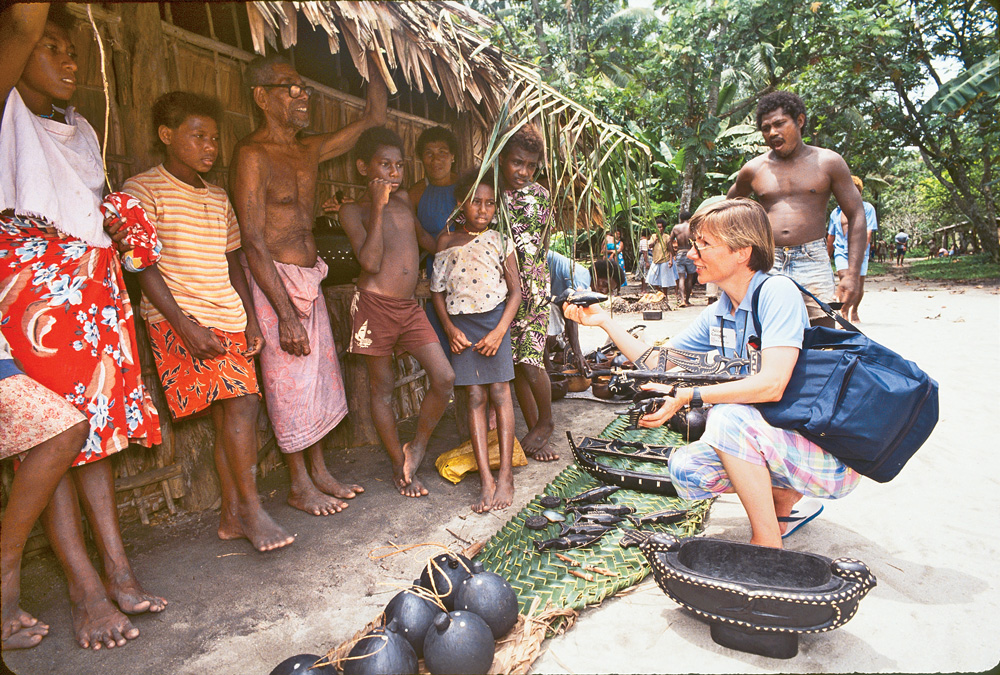 Coogan in a South Pacific village with villagers
