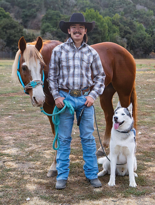 Ryan Jae with a horse and dog.
