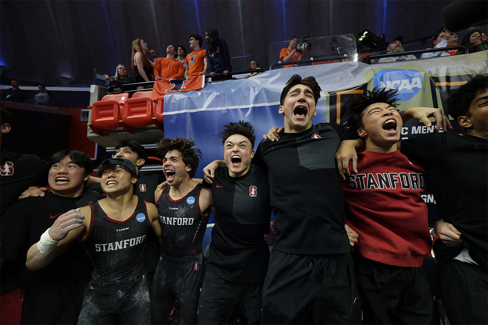The men's gymnastic team celebrating