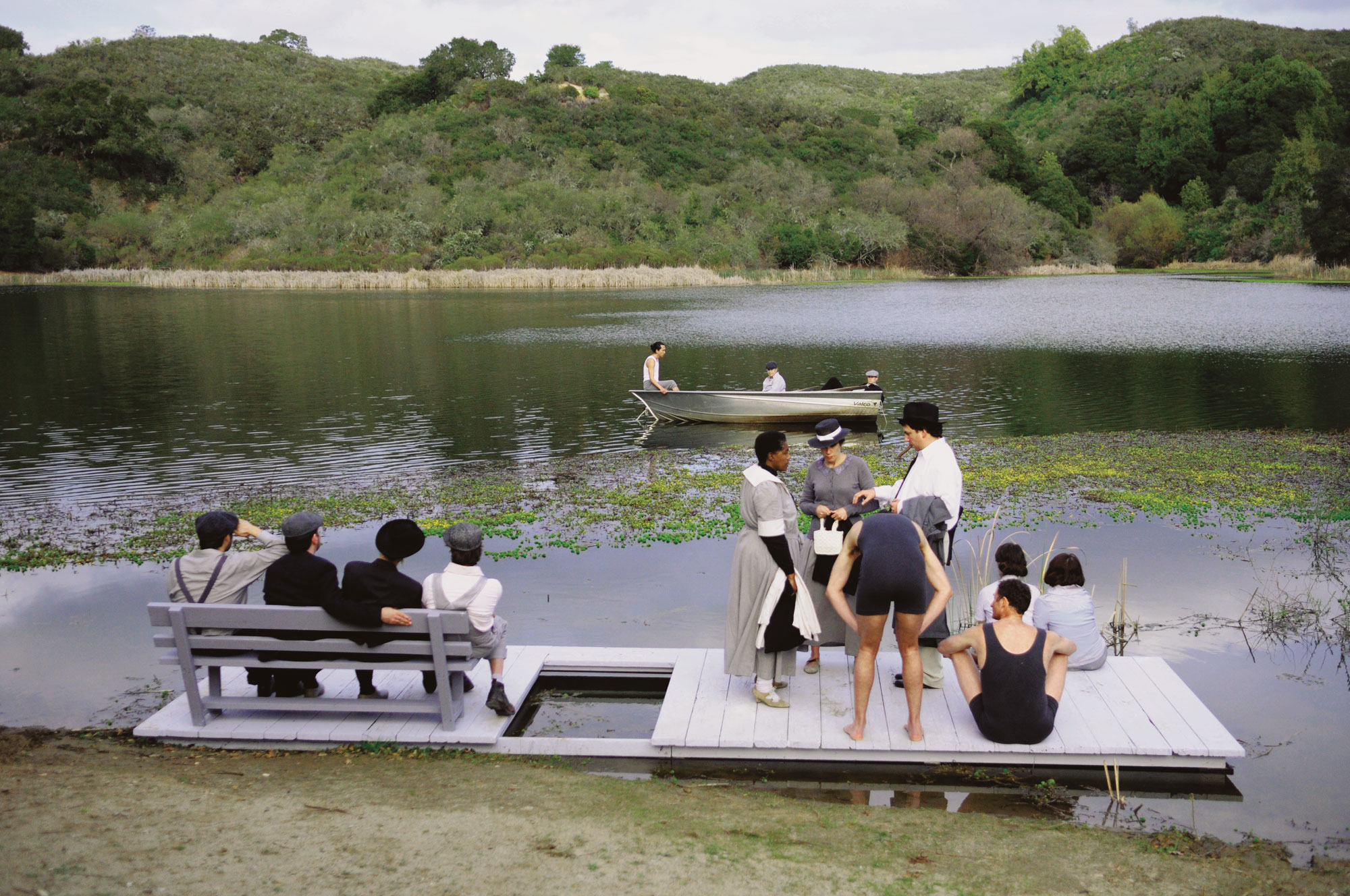 Color image of boaters and others at Searsville Lake