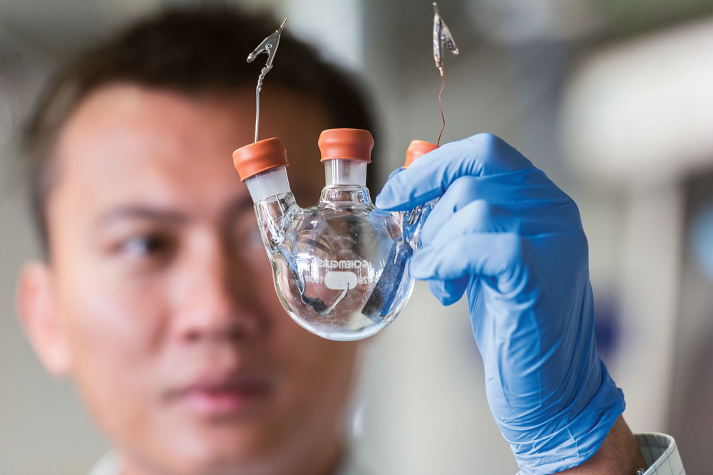 Yi Cui holding a test tube