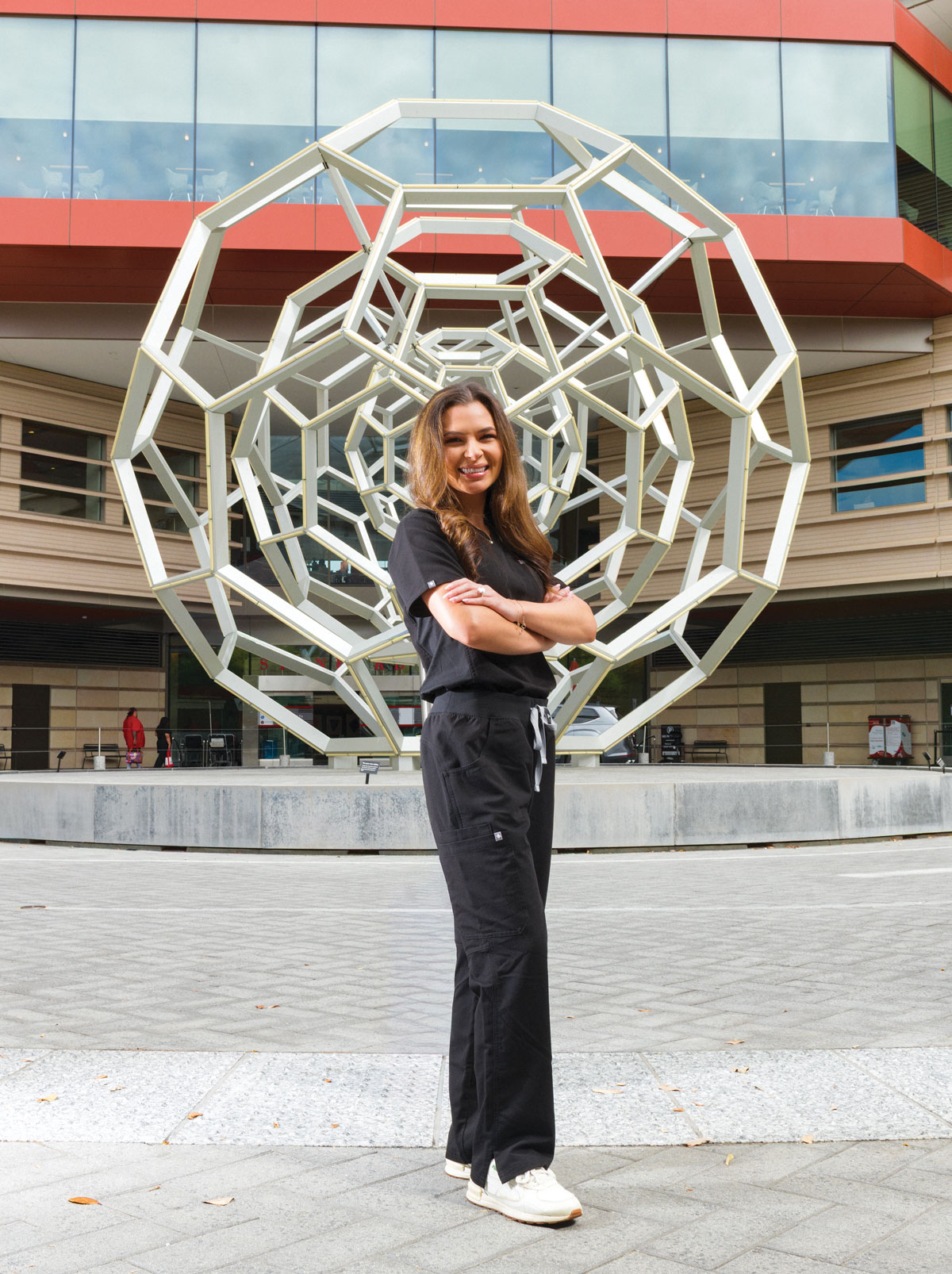 Josie Pearce at at the Buckyball sculpture outside Stanford Hospital.