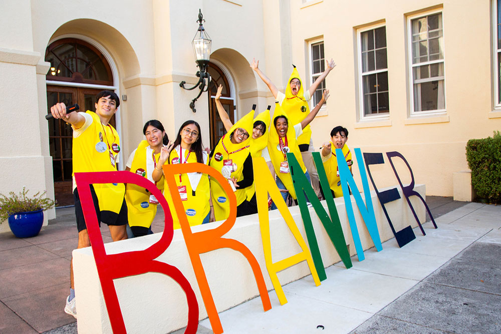 Branner RAs in banana costumes greet students.