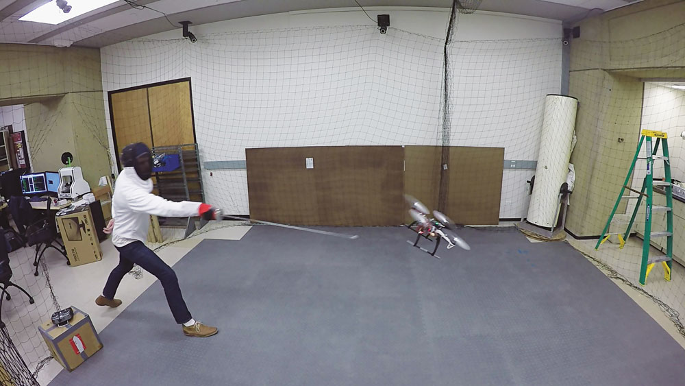 A person fencing with a drone